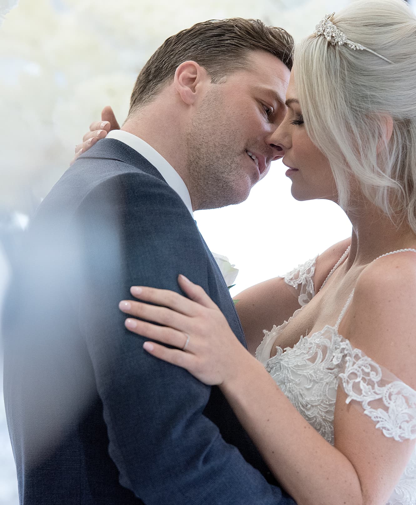 Couple embracing on their wedding day