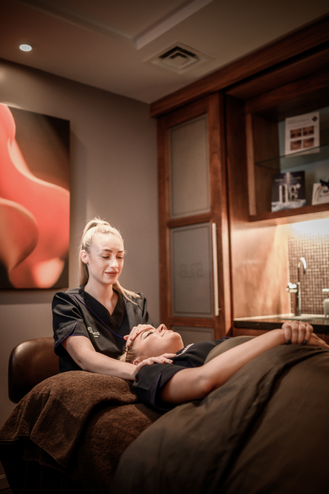 Two people enjoying a facial treatment at Aura Spa