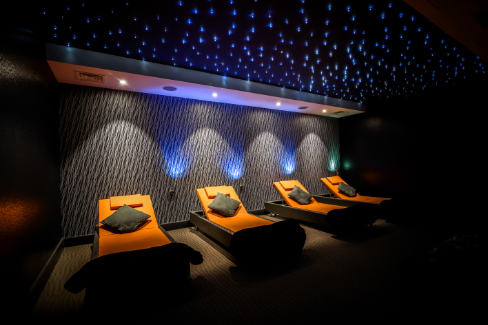 Four Aura Spa relaxation chairs in a row