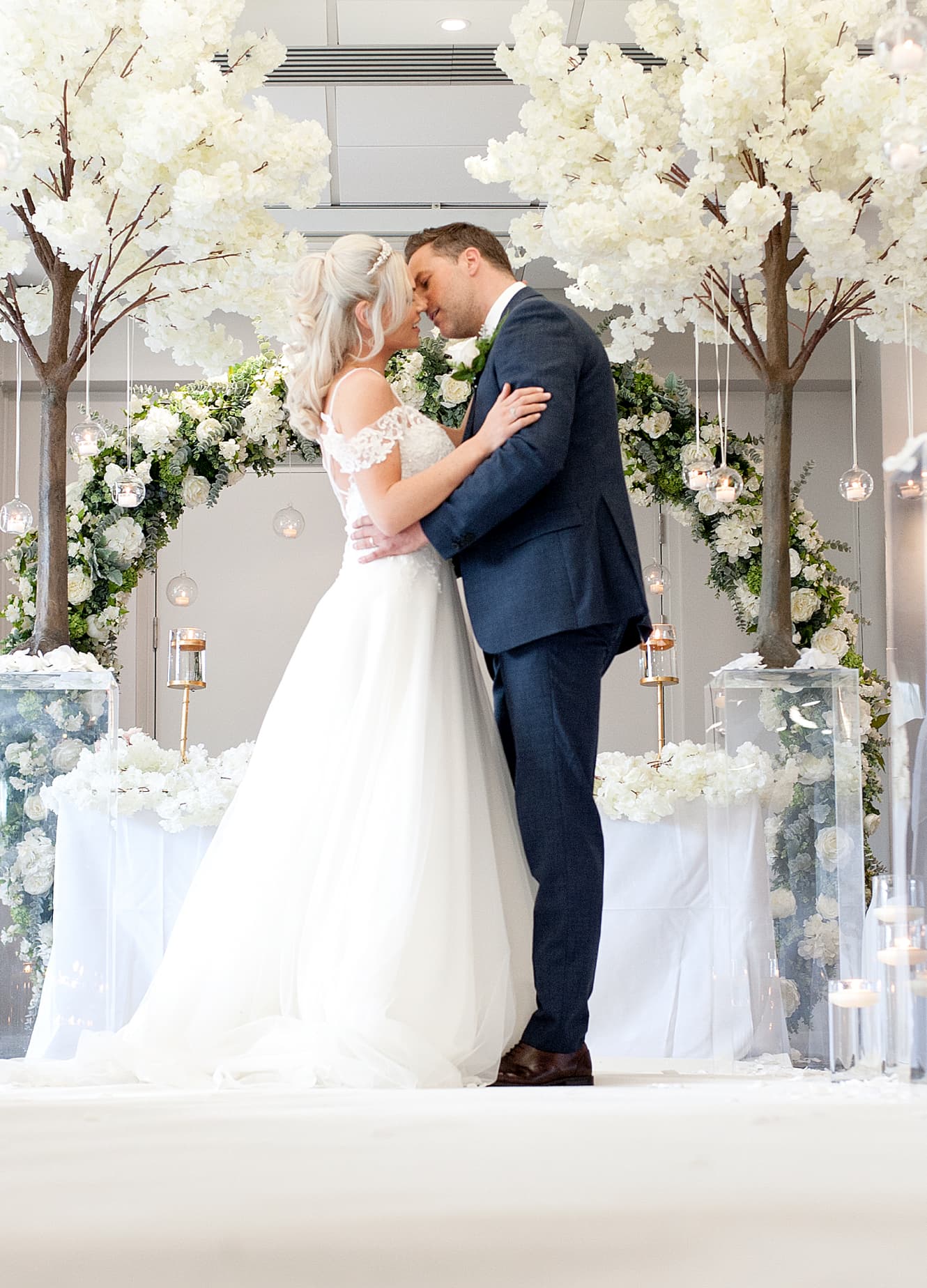 Couple embracing on the aisle during their wedding day